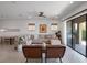 Spacious living room with comfortable seating, tiled floors, and access to the outdoor patio at 960 Golden Bear Dr, Reunion, FL 34747