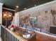 Upstairs loft featuring city wallpaper and a cozy seating area for entertainment at 960 Golden Bear Dr, Reunion, FL 34747