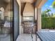 Outdoor kitchen with built-in stainless steel grill and granite countertops at 960 Golden Bear Dr, Reunion, FL 34747