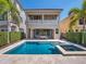 Backyard pool and spa with patio and outdoor dining set on the lanai, perfect for entertaining at 960 Golden Bear Dr, Reunion, FL 34747