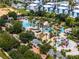 Community water park with pools, slides, palm trees, and blue and white architecture, perfect for Gathering fun at 960 Golden Bear Dr, Reunion, FL 34747