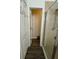 Bathroom with a shower featuring a glass door, wood floors and white door and baseboards at 9959 Cypress Vine Dr, Orlando, FL 32827