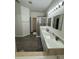 Bright bathroom featuring a double sink vanity, shower and tub at 9959 Cypress Vine Dr, Orlando, FL 32827