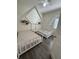 Charming bedroom with two twin-sized canopy beds, stylish decor, and plenty of natural light creating a cozy atmosphere at 9959 Cypress Vine Dr, Orlando, FL 32827