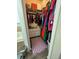 Walk-in closet with hardwood floors, shelving, and ample storage space at 9959 Cypress Vine Dr, Orlando, FL 32827