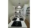 Spacious dining area with seating for six and an open view into the kitchen at 9959 Cypress Vine Dr, Orlando, FL 32827