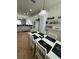 Dining space featuring a white table with matching chairs, open to the kitchen and living area at 9959 Cypress Vine Dr, Orlando, FL 32827