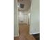 Neutral hallway featuring tile floors, doors, and access to rooms at 9959 Cypress Vine Dr, Orlando, FL 32827