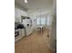 Bright kitchen with white appliances and dining area featuring lots of natural light at 9959 Cypress Vine Dr, Orlando, FL 32827