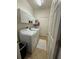 Well-equipped laundry room with white cabinets, a washer and dryer, and a tile floor for easy maintenance at 9959 Cypress Vine Dr, Orlando, FL 32827