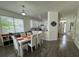 Open-concept living space with dining area, seamlessly connected to the kitchen for modern living and convenience at 9959 Cypress Vine Dr, Orlando, FL 32827