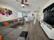 Open concept living area boasts hardwood floors and bright, modern decor at 9959 Cypress Vine Dr, Orlando, FL 32827