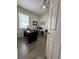 Office space featuring a black desk, office chair, and neutral walls at 9959 Cypress Vine Dr, Orlando, FL 32827