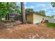 Spacious backyard with a swing, mature tree, and plenty of room for outdoor activities and entertaining at 1018 Featherstone Cir, Ocoee, FL 34761