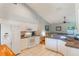 Well-lit kitchen featuring a breakfast bar, tile flooring, and modern appliances at 1018 Featherstone Cir, Ocoee, FL 34761
