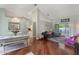 Inviting living room with hardwood floors, neutral walls, and access to the outdoor pool area at 1018 Featherstone Cir, Ocoee, FL 34761