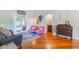 Cozy sitting area with wood floors, neutral decor, and comfortable seating at 1018 Featherstone Cir, Ocoee, FL 34761