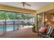 Screened patio with pool access and comfortable seating, perfect for outdoor relaxation and entertaining at 1018 Featherstone Cir, Ocoee, FL 34761