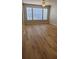 Bright bedroom with hardwood floors and large windows offering plenty of natural light at 1071 S Hiawassee Rd # 1211, Orlando, FL 32835