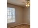Bedroom with window, ceiling fan and wood floors at 1071 S Hiawassee Rd # 1211, Orlando, FL 32835