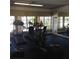 Community gym includes treadmills, elliptical and stationary bike in naturally lit room at 1071 S Hiawassee Rd # 1211, Orlando, FL 32835