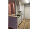 Kitchen with a breakfast bar, stainless steel sink, and white appliances at 1071 S Hiawassee Rd # 1211, Orlando, FL 32835