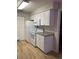 Well-lit kitchen with white appliances, cabinets, and durable countertops at 1071 S Hiawassee Rd # 1211, Orlando, FL 32835