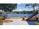 Scenic lake view between two condo buildings, complete with black metal staircase at 1071 S Hiawassee Rd # 1211, Orlando, FL 32835