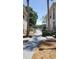 Scenic community path leading to lake views with lush greenery and well-kept landscaping at 1071 S Hiawassee Rd # 1211, Orlando, FL 32835