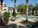 Community pool featuring patio tables and palm trees at 1071 S Hiawassee Rd # 1211, Orlando, FL 32835