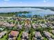 Wide aerial shot of home in beautiful community overlooking a lake and surrounded by lush landscaping at 11502 Waterstone Loop Dr, Windermere, FL 34786