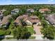 Expansive aerial view highlighting a private home and landscaping, nestled within a lush lakeside community at 11502 Waterstone Loop Dr, Windermere, FL 34786