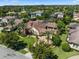 Expansive aerial view highlighting a private home and landscaping, nestled within a lush lakeside community at 11502 Waterstone Loop Dr, Windermere, FL 34786