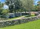 Scenic view of a stone bridge over a waterway, surrounded by lush greenery at 11502 Waterstone Loop Dr, Windermere, FL 34786