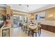 Elegant dining area with stylish chandelier and patio access at 11502 Waterstone Loop Dr, Windermere, FL 34786