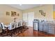 Bright dining area featuring laminate flooring, doors to backyard and a mini bar area at 11502 Waterstone Loop Dr, Windermere, FL 34786