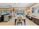 Dining room with modern decor, access to backyard and comfortable seating at 11502 Waterstone Loop Dr, Windermere, FL 34786