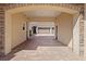 Brick-paved driveway leading to a spacious three-car garage with mature landscaping at 11502 Waterstone Loop Dr, Windermere, FL 34786