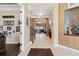 Spacious foyer with staircase and views into the open concept living space at 11502 Waterstone Loop Dr, Windermere, FL 34786