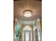 Elegant layered ceiling with decorative modern chandeliers above the foyer at 11502 Waterstone Loop Dr, Windermere, FL 34786