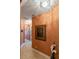 Hallway featuring decorative walls, tile floors, artwork, and decorative light fixtures at 11502 Waterstone Loop Dr, Windermere, FL 34786