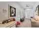 Cozy hallway with a modern light fixture, stylish decor, and a view of the french doors at 11502 Waterstone Loop Dr, Windermere, FL 34786