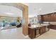 Gourmet kitchen open to the living room with stainless appliances and granite counters at 11502 Waterstone Loop Dr, Windermere, FL 34786