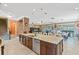 Expansive kitchen island overlooking seating area, living room and backyard at 11502 Waterstone Loop Dr, Windermere, FL 34786