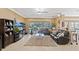 Inviting living room with a plush rug, large windows, and comfortable seating at 11502 Waterstone Loop Dr, Windermere, FL 34786