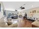 Spacious main bedroom offers versatile living with seating and dining area, great for relaxation and entertaining at 11502 Waterstone Loop Dr, Windermere, FL 34786