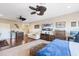 Cozy main bedroom offers mini-bar, carpet and tv with plenty of space for seating at 11502 Waterstone Loop Dr, Windermere, FL 34786
