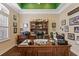 Inviting home office with custom wood desk, built-in bookcase, and neutral color palette at 11502 Waterstone Loop Dr, Windermere, FL 34786