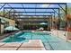 Screened-in pool with spa offers relaxing views and a space to soak up the sun at 11502 Waterstone Loop Dr, Windermere, FL 34786