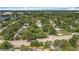 Aerial view of the home in a residential neighborhood, surrounded by mature trees and lush landscaping at 1202 Chichester St, Orlando, FL 32803